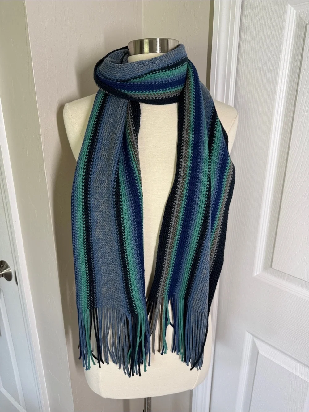 Blue and green striped knit scarf with fringe